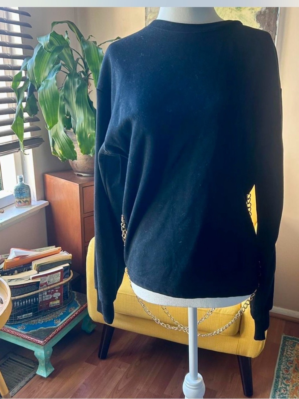 AKIRA Black Crewneck Sweater with Chain Accent